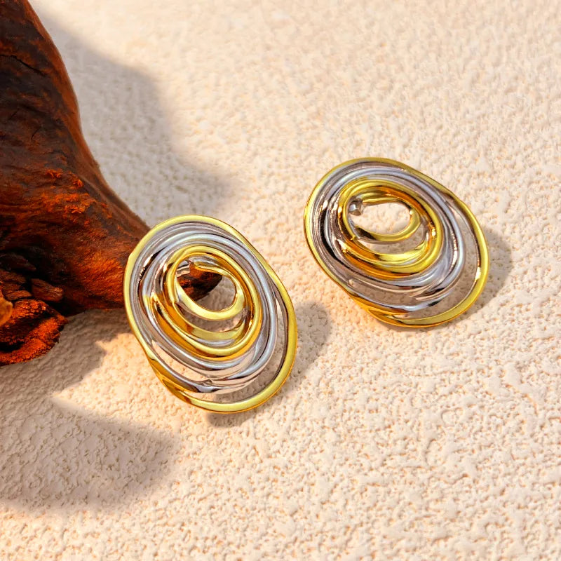 M02 - Aretes varios óvalos. Color dorado con plateado. Acero inoxidable.