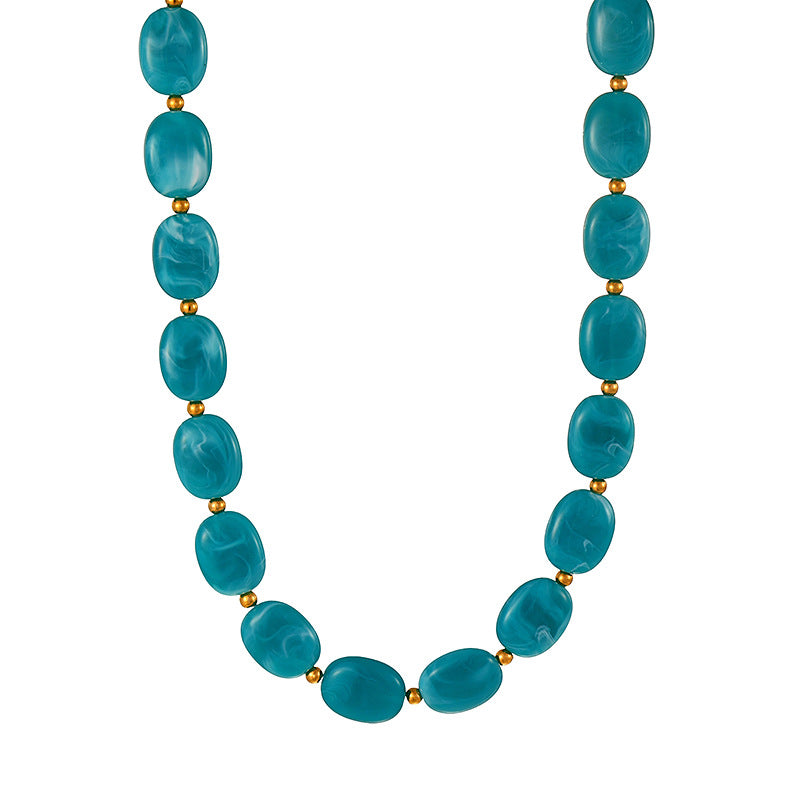 C01 - Collar óvalos color azul petroleo. Resina.