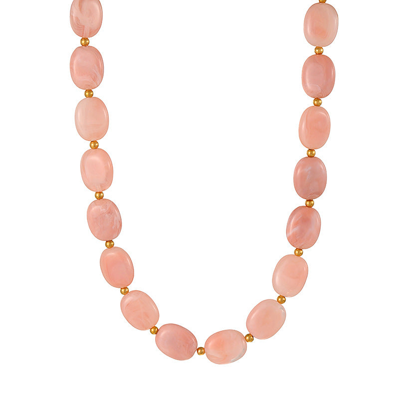 C04 - Collar óvalos color rosa palo. Resina.