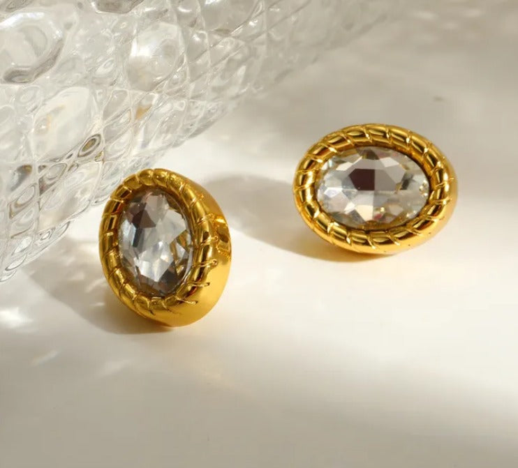 D10 - Aretes óvalo con cristal. Color dorado. Acero inoxidable.