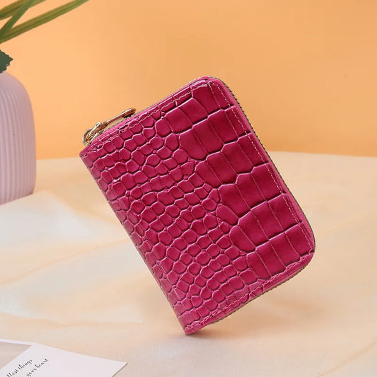Cartera chica. Color rosa fucsia.