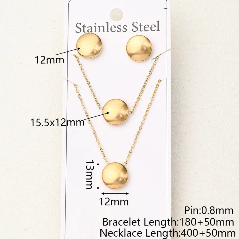 Juego aretes, pulsera, collar con circulo. Color dorado. Acero inoxidable.