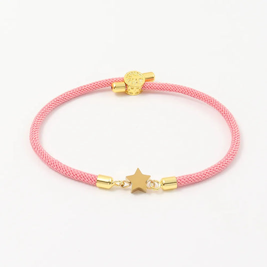 Pulsera ajustble de nilon con estrella. Color rosa con dorado. Acero inoxidable.