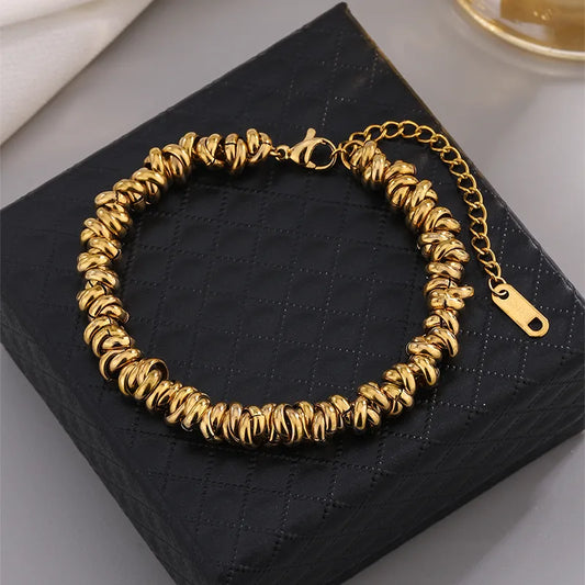 Pulsera de circulos. Color dorado. Acero inoxidable.