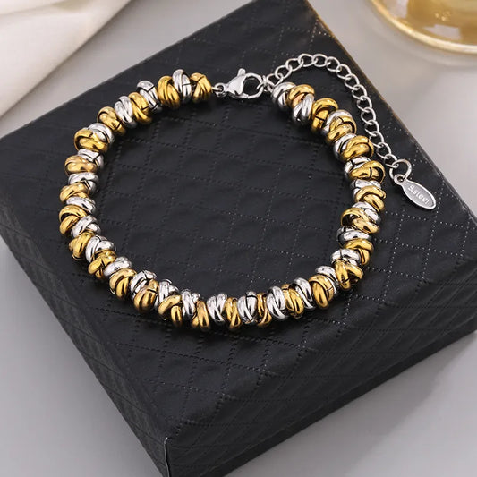 Pulsera de circulos. Color dorado con plateado. Acero inoxidable.
