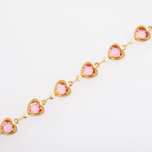Collar con corazones y cristales rosas. Color dorado. Acero inoxidable.