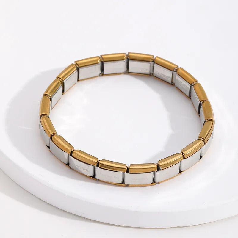 Pulsera italiana. Acero inoxidable. Color dorado con centro plata.