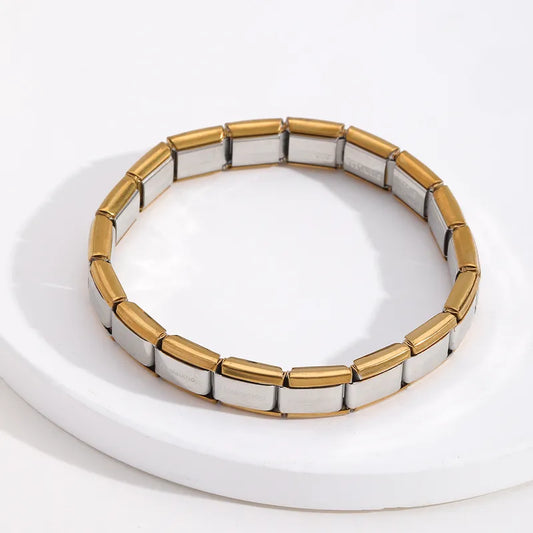 Pulsera italiana. Acero inoxidable. Color dorado con centro plata.