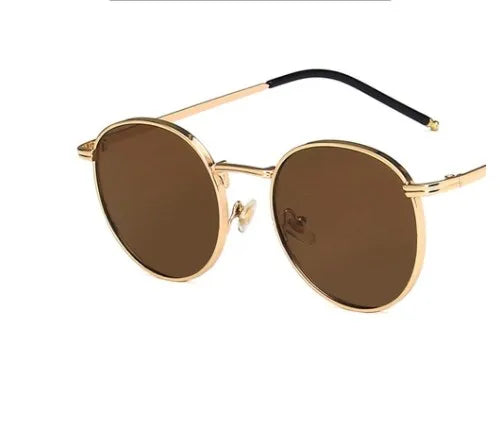 Lentes para sol. Armazón dorado 6.