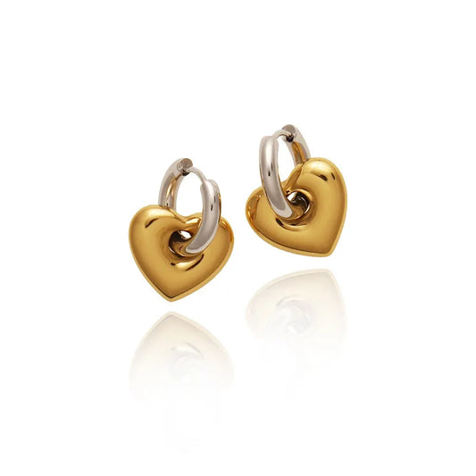 Arracada doble función con corazón. Color dorado con plateado. Acero inoxibale.