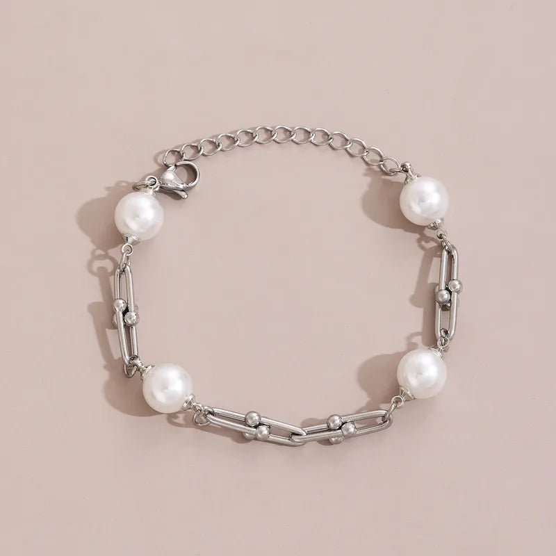 Pulsera eslabones con perla. Color plateado. Acero inoxidable.