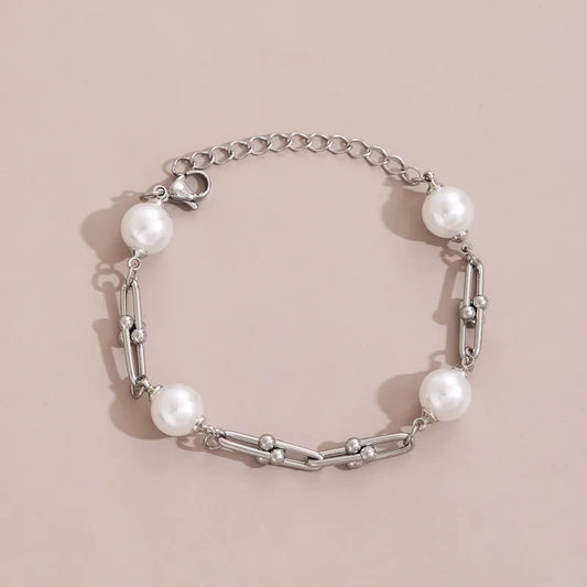 Pulsera eslabones con perla. Color plateado. Acero inoxidable.