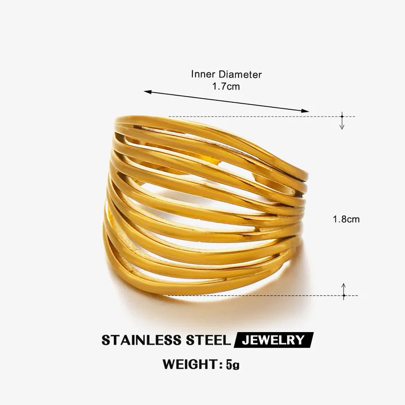 A02 - Anillo grueso de varias líneas, ajustable. Color dorado. Acero inoxidable.