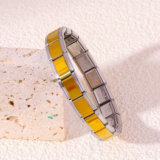 Pulsera italiana. Color dorado con plateado. Acero inoxidable.