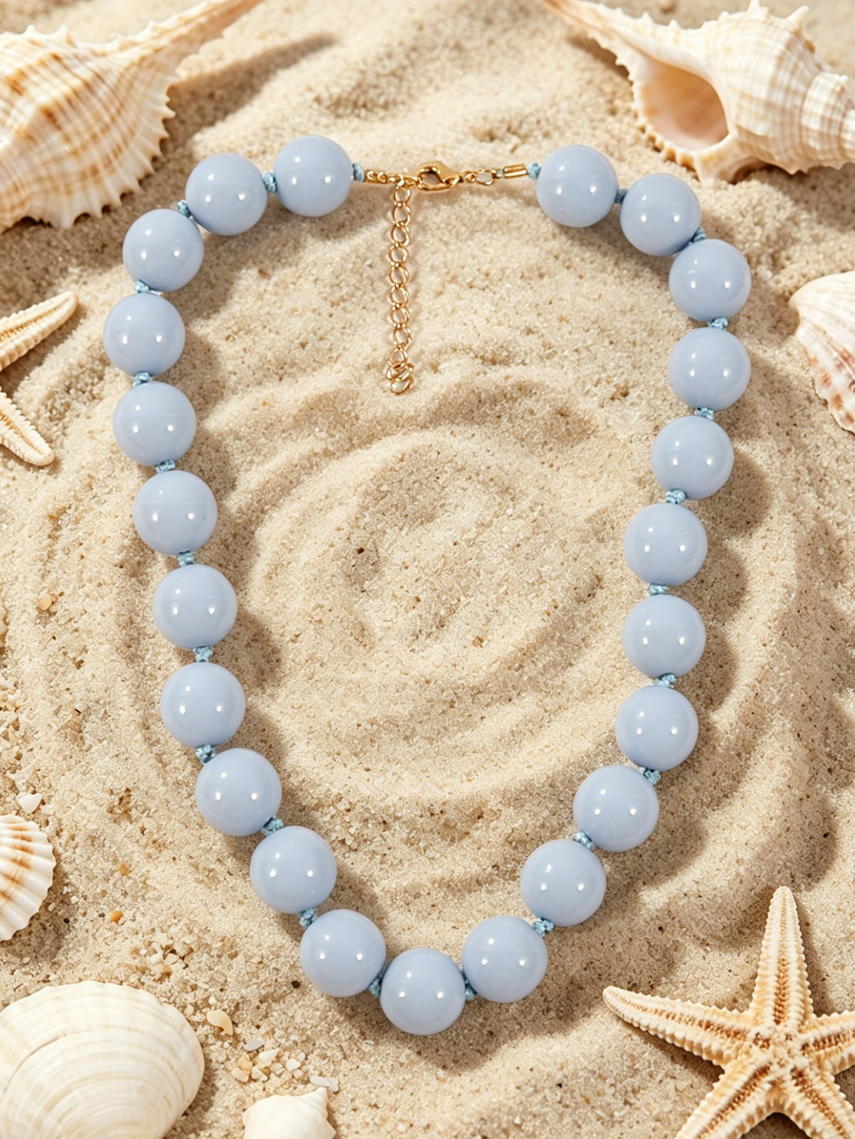 C07 - Collar bolas azul cielo. Resina.