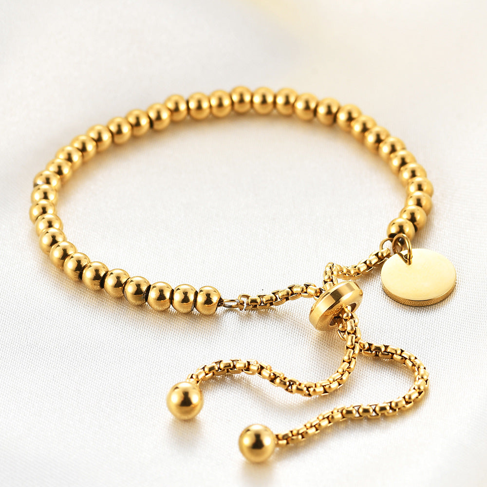 C20 - Pulsera bolitas, ajustable. Color dorado. Acero inoxidable.