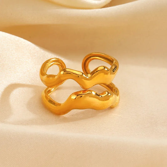 E02 - Anillo doble, ajustable. Color dorado. Acero inoxidable.