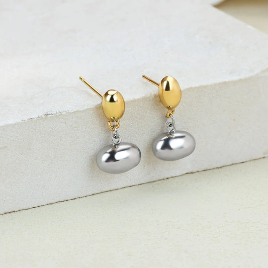 E15 - Aretes de óvalos, chicos. Color dorado y plateado. Acero inoxidable.