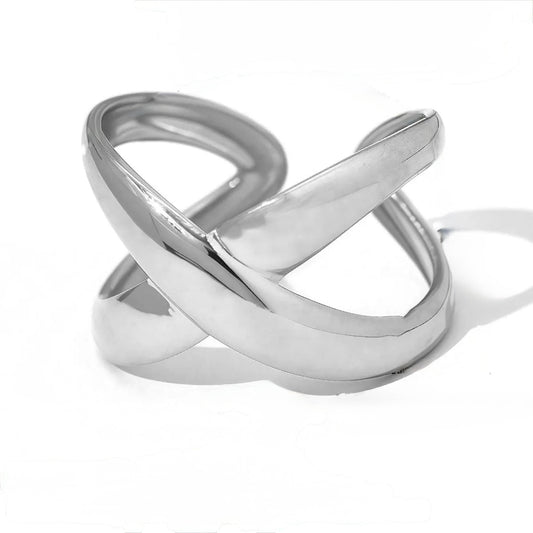 F20 - Anillo cruz, ajustable. Color plateado. Acero inoxidable.