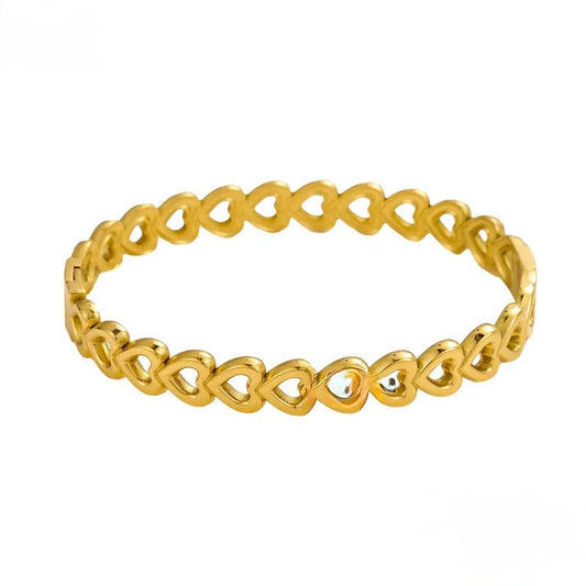 C14 - Pulso corazones. Color dorado. Acero inoxidable.