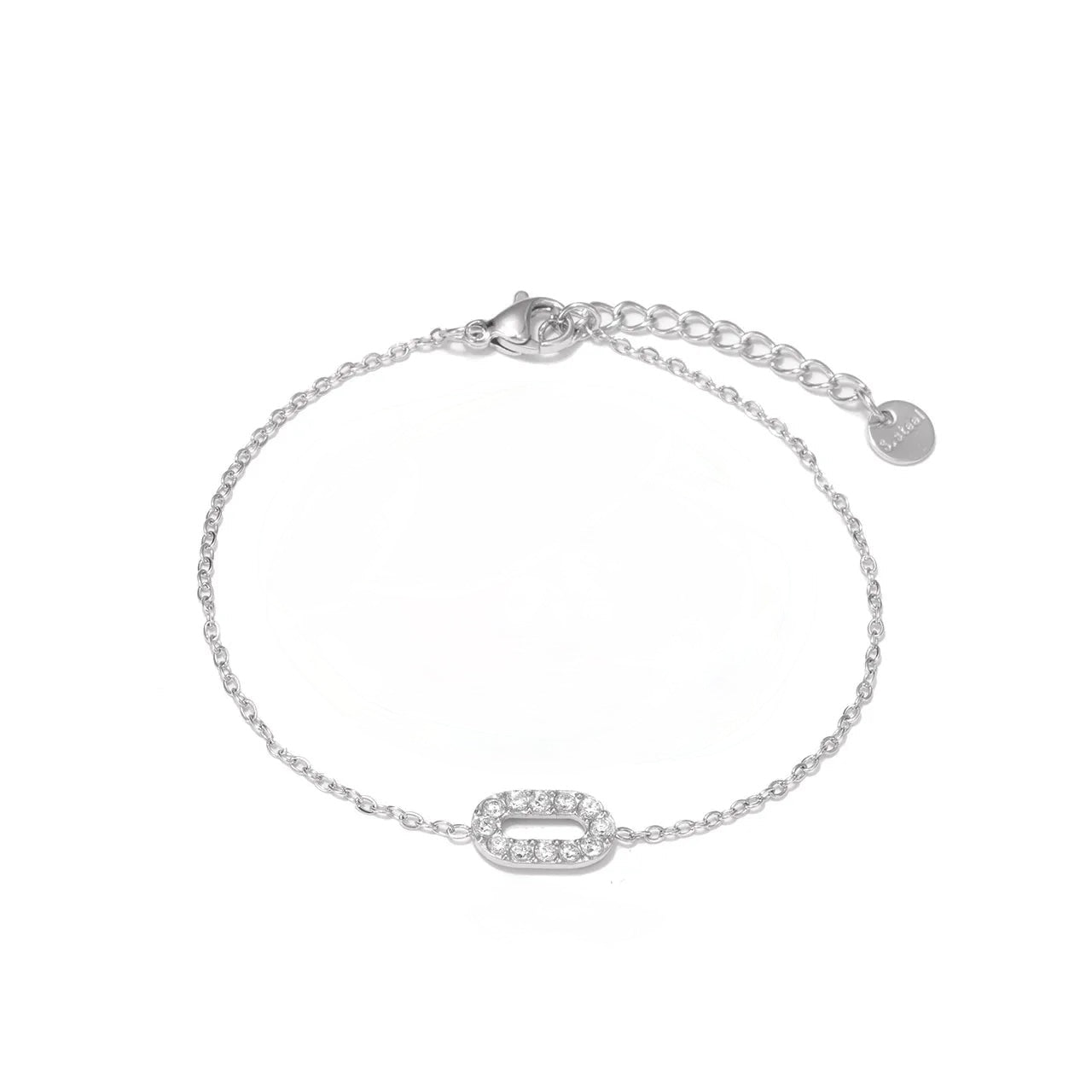 J27 - Pulsera con dije con circonias. Color plateado. Acero inoxidable.