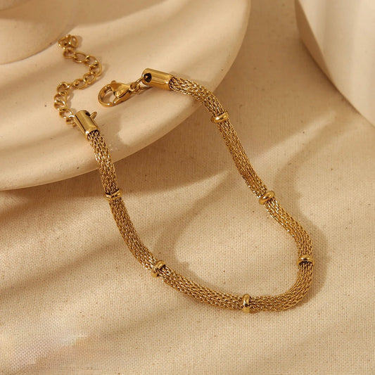 J30 - Pulsera tipo red. Color dorado. Acero inoxidable.