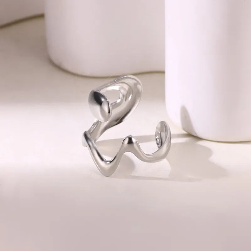 G12 - Anillo forma, ajustable. Color plateado. Acero inoxidable.