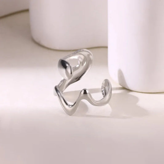 G12 - Anillo forma, ajustable. Color plateado. Acero inoxidable.