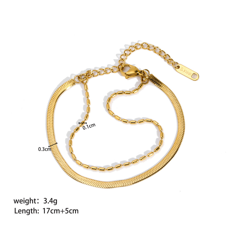 Pulsera doble. Color dorado. Acero inoxidable.