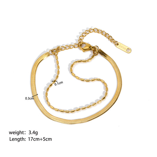 Pulsera doble. Color dorado. Acero inoxidable.