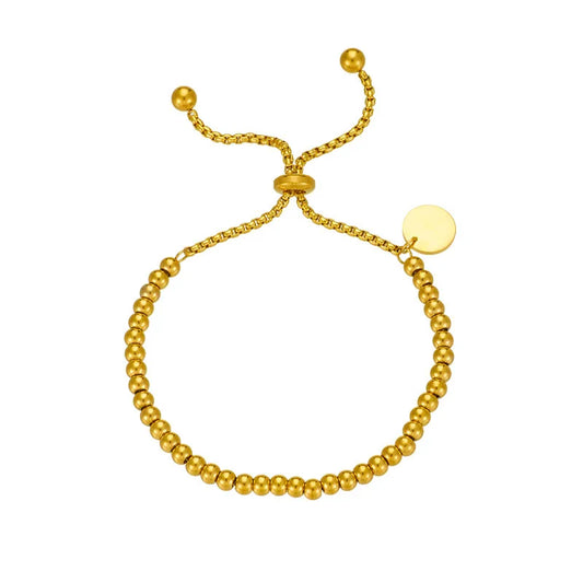 N09 - Pulsera de bolitas con dije chico de circulo, ajustable. Color dorado. Acero inoxidable.